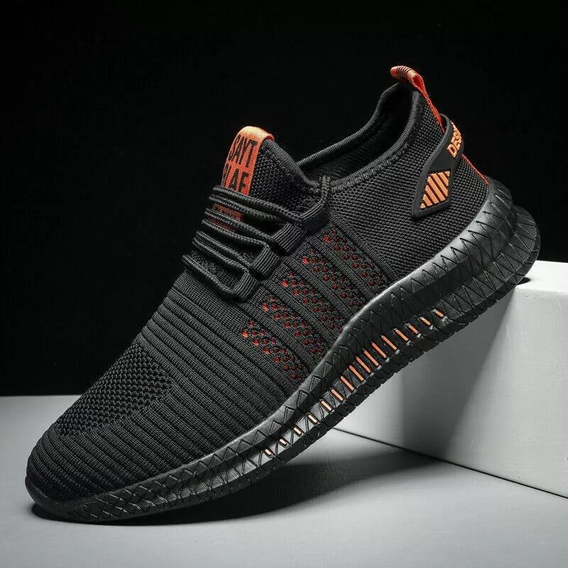 Side view of AeroStride breathable black-orange men's running sneakers on neutral background
